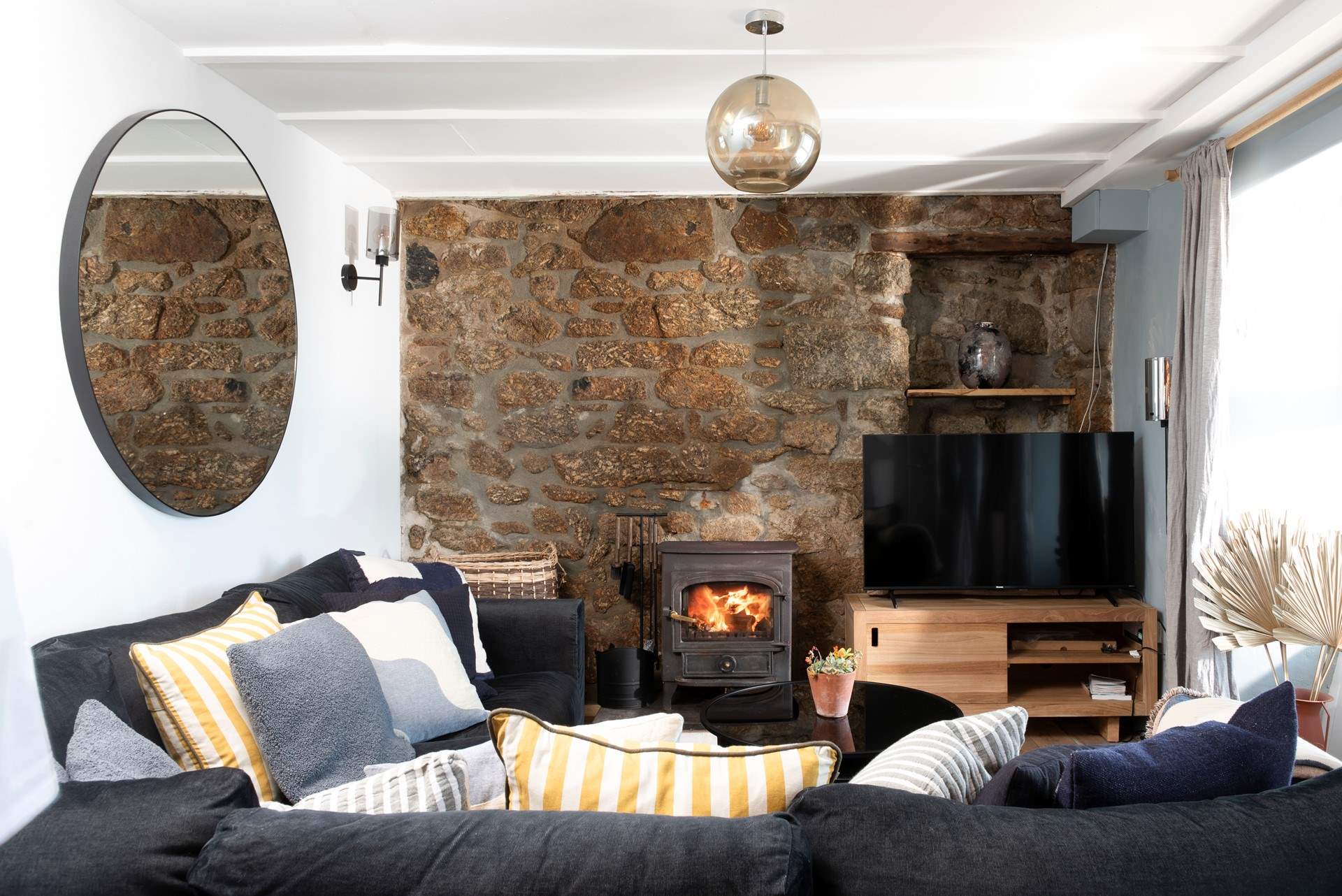 Snuggle up on the plush sofa warmed by the wood-burner on a chilly evening.