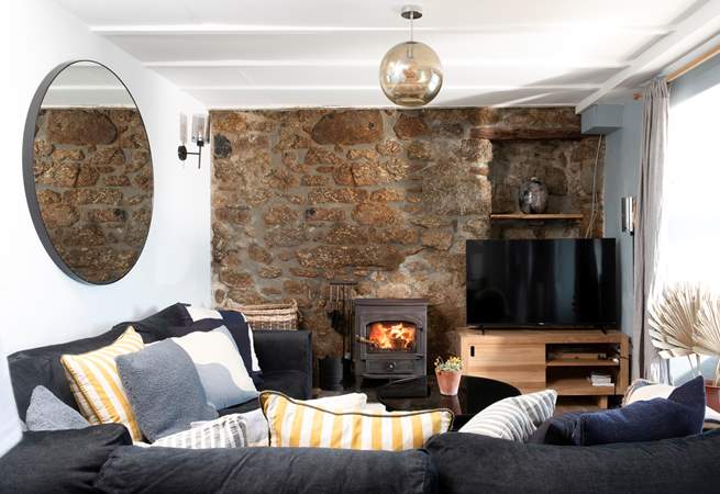 Snuggle up on the plush sofa warmed by the wood-burner on a chilly evening.