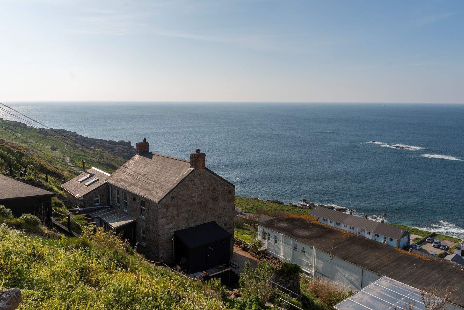 Peter's Cottage with its amazing view and access to the South West Coast Path to the left.