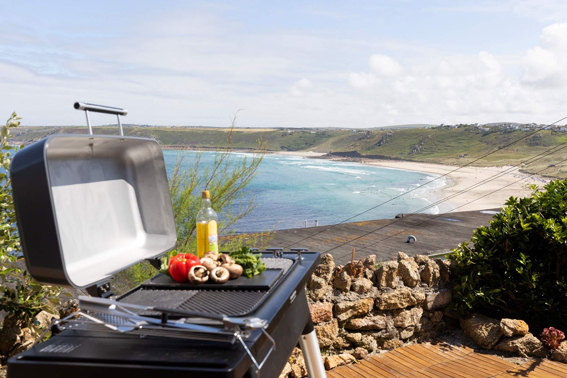 Enjoy dinner al fresco overlooking the sandy cove.
