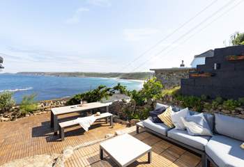 Peter's Cottage, the terrace with a view, take care as there is a small drop the other side of the low wall.