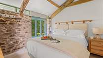 Bedroom 3 is super inviting. How magnificent are those vaulted ceilings!