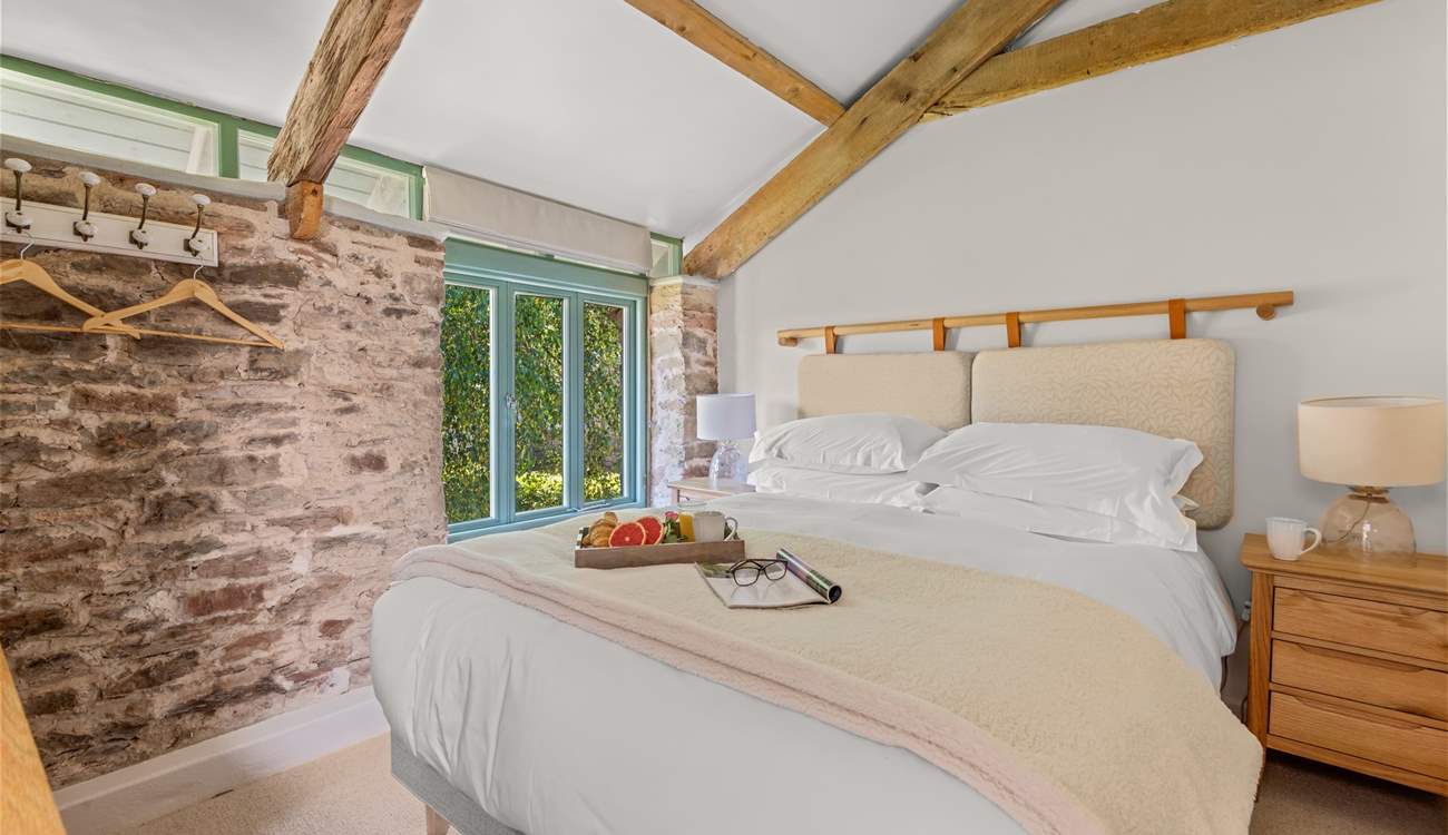 Bedroom 3 is super inviting. How magnificent are those vaulted ceilings!