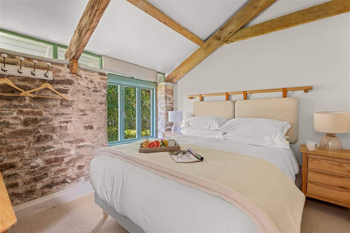 Bedroom 3 is super inviting. How magnificent are those vaulted ceilings!