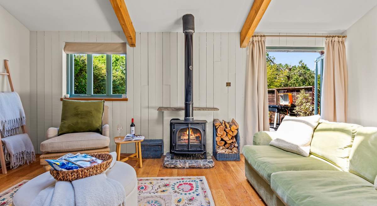 This fabulous living area is complemented by a fabulous wood-burner.