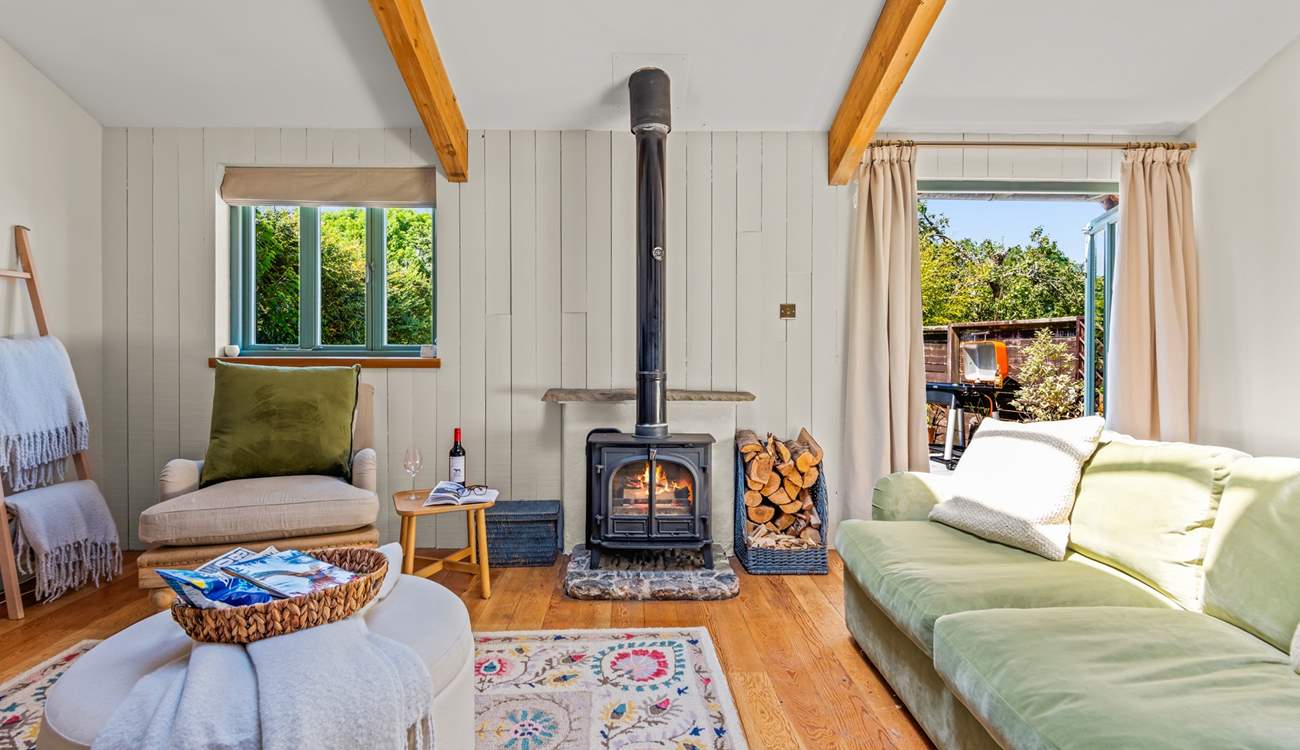 This fabulous living area is complemented by a fabulous wood-burner.