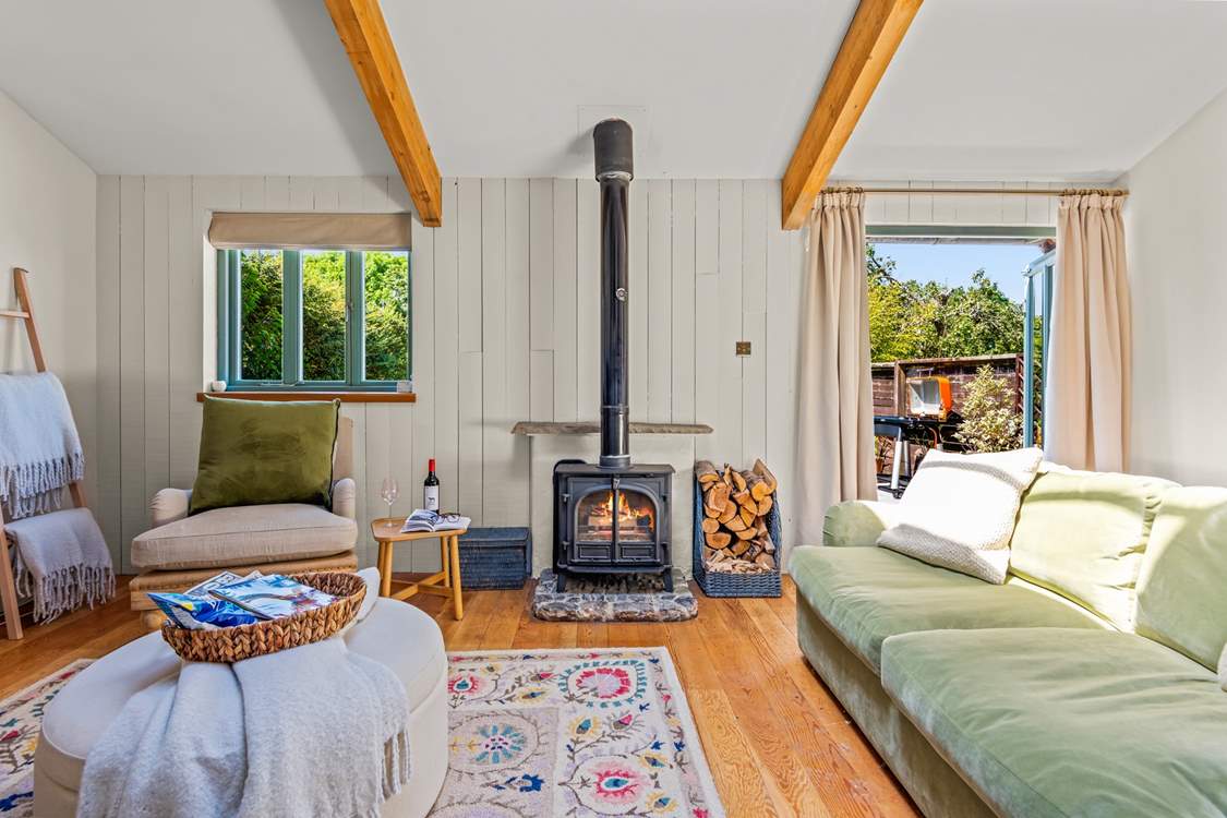 This fabulous living area is complemented by a fabulous wood-burner.