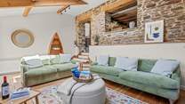 The living-room is accessed by a small flight of steps from the kitchen.