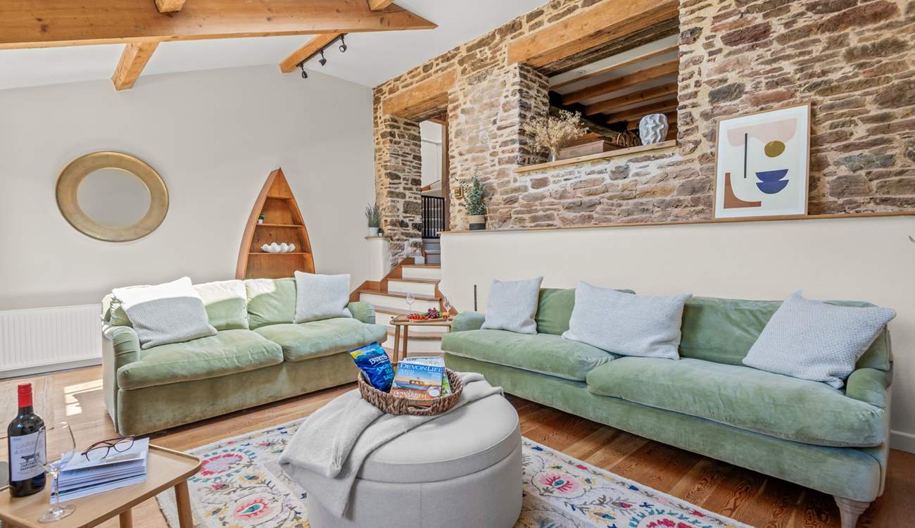 The living-room is accessed by a small flight of steps from the kitchen.