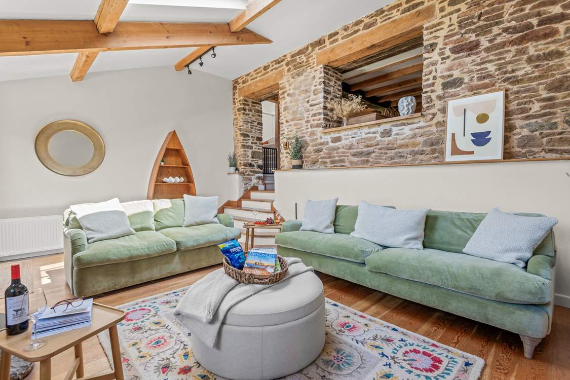 The living-room is accessed by a small flight of steps from the kitchen.