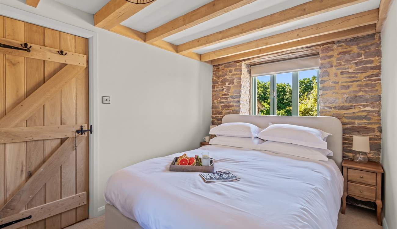 Bedroom 1 is home to this super inviting king-size bed.