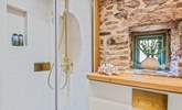 Beautiful exposed stone features can even be enjoyed in the shower-rooms. - Thumbnail Image