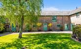 Camellia Cottage is nestled in this picture perfect courtyard. - Thumbnail Image