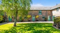 Camellia Cottage is nestled in this picture perfect courtyard.