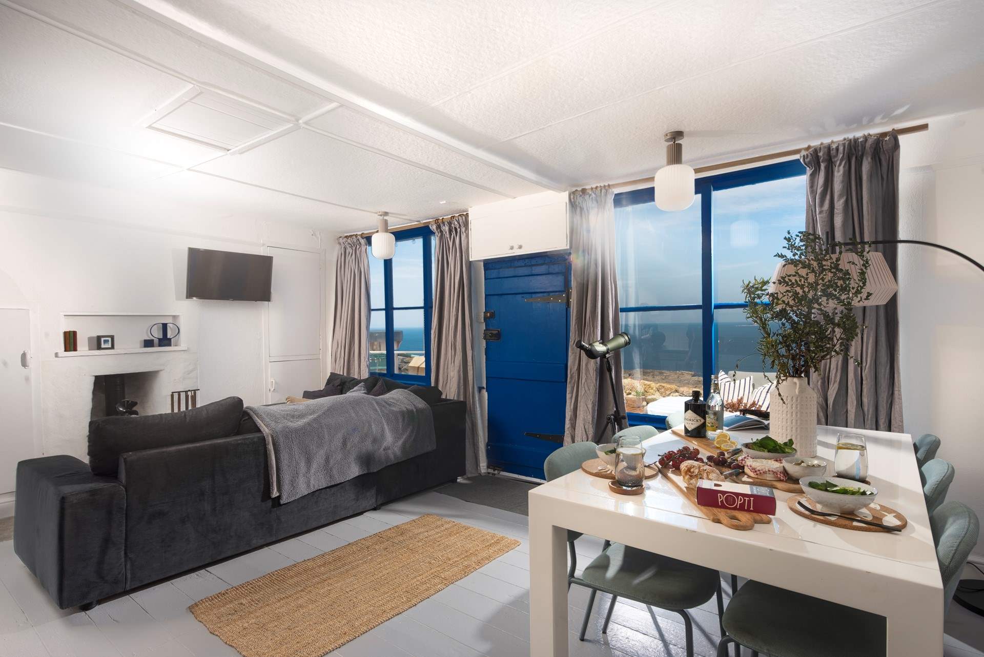 The views fill the open plan living area and there's a wood-burner too. 