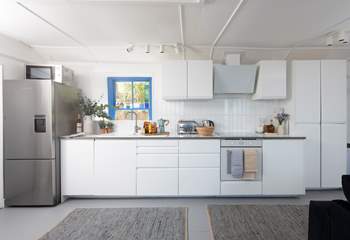 A luxury modern kitchen in the open plan living area, perfect to cook up a feast.