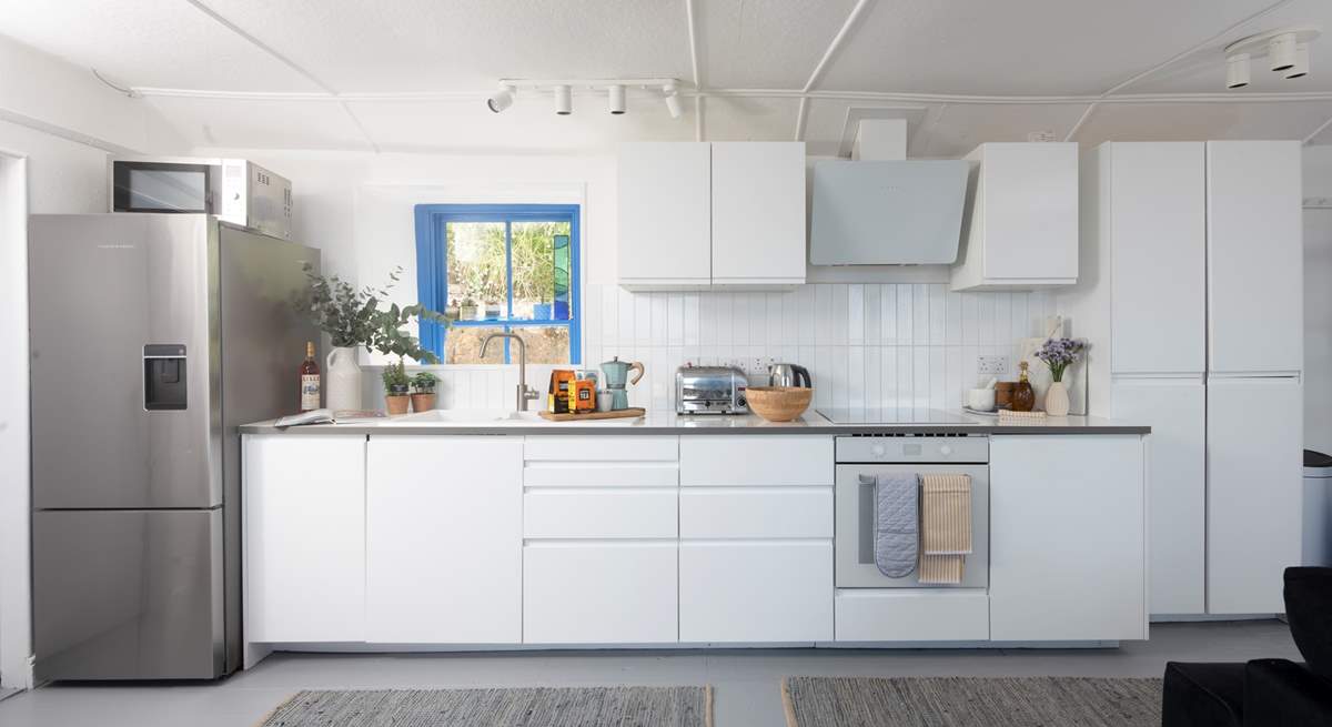 A luxury modern kitchen in the open plan living area, perfect to cook up a feast.