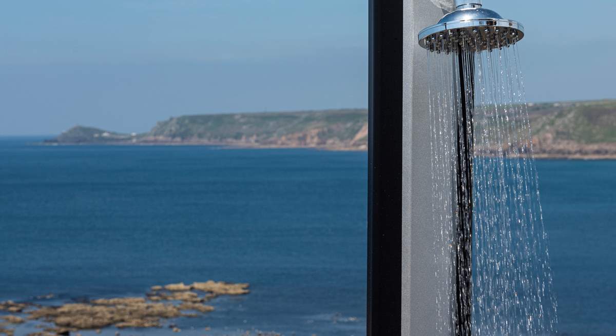 An outdoor shower to wash away the salty day.