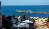 Take in the fresh sea air on the comfy outdoor sofa.  - Thumbnail Image