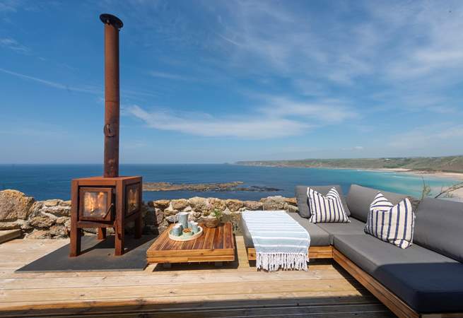 Relax on the terrace at the front of this beautiful cottage.