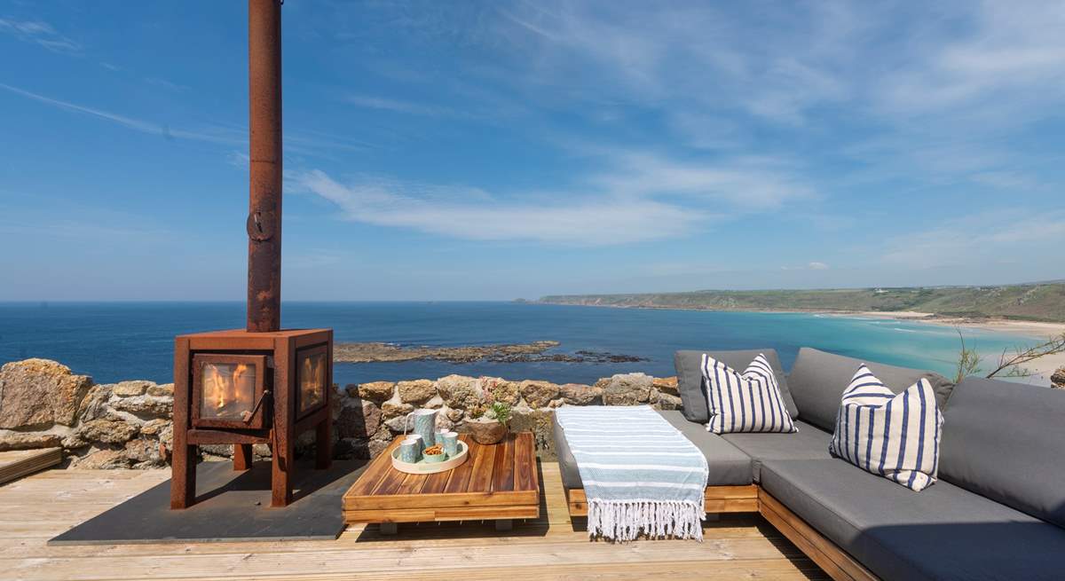 Relax on the terrace at the front of this beautiful cottage.