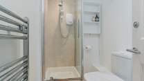 The en suite shower-room is bright and modern.