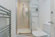 The en suite shower-room is bright and modern.