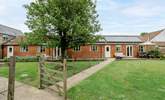 The Dairy is next door to The Granary and the gardens are separated by a wire fence. Privacy is ensured with the trellis just visible behind the tree.  - Thumbnail Image