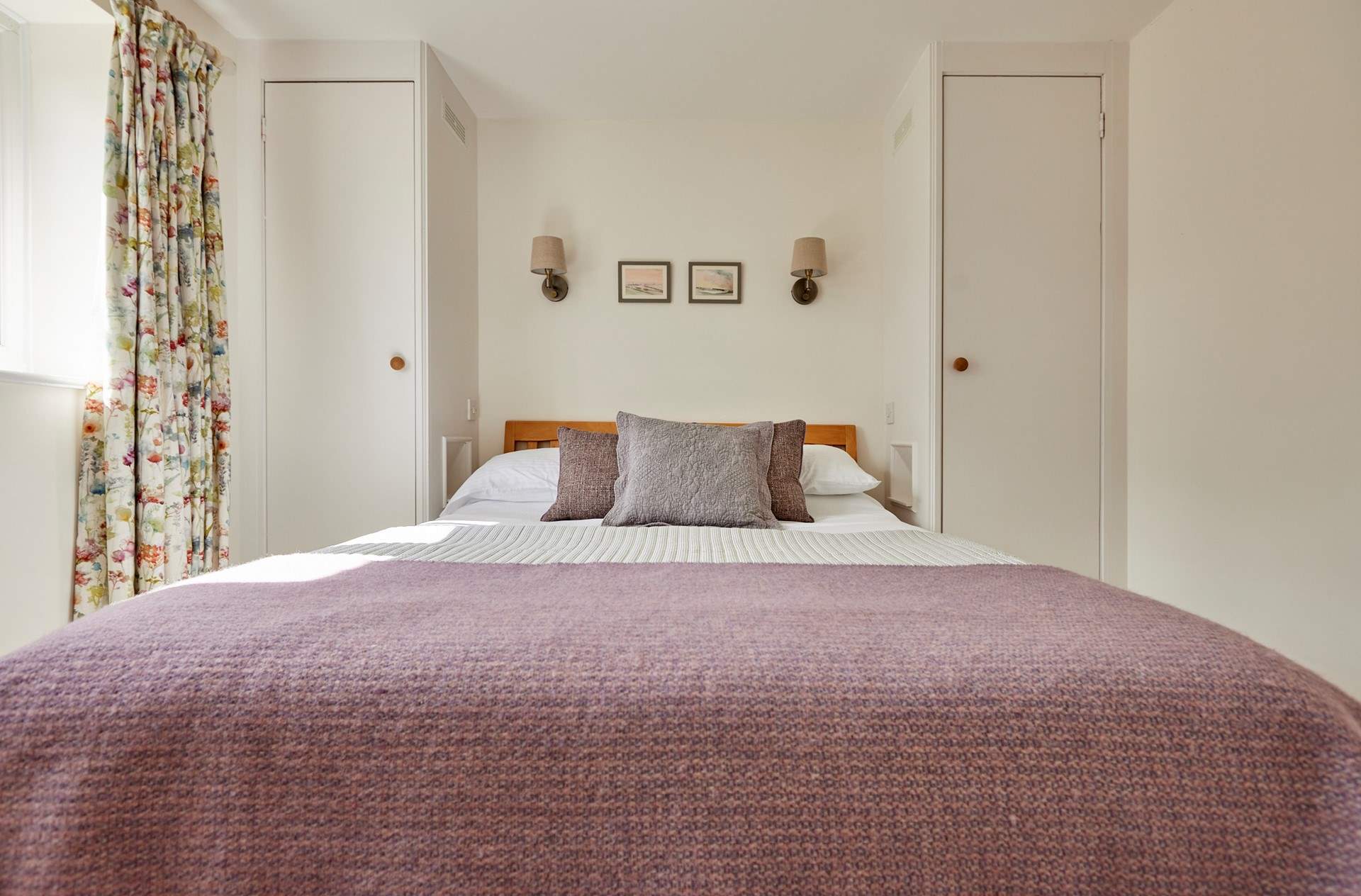 The primary bedroom (with en-suite shower room) has a tempting king size bed and plenty of storage. All complimented by the blissful peace and quiet of the countryside.