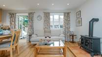 The open plan living space has doors out to the terrace and a very cosy feel.
