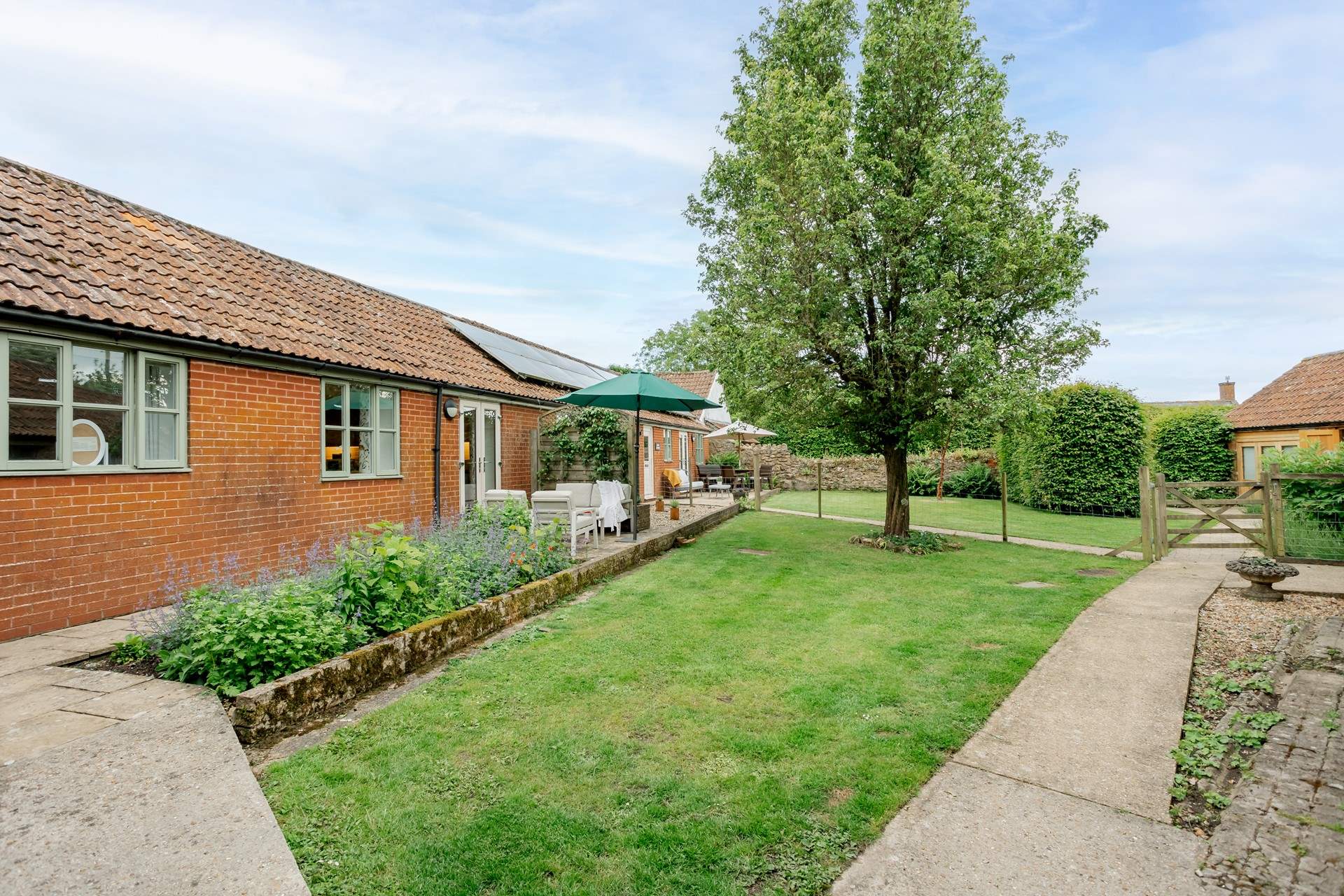 The Granary is separated from The Dairy by a wire fence and trellis ensuring privacy. 