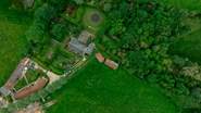 Looking from above - The Granary is the property next to the one with solar panels and the woodland is on the right hand side of the photo, beyond the owners' home.