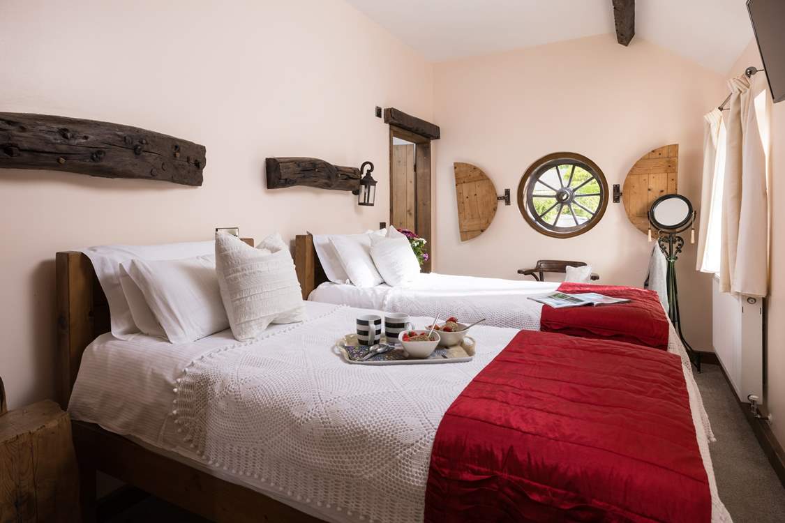 Reclaimed and vintage materials such as the wheel window are dotted all over Clover Leaf Cottage.