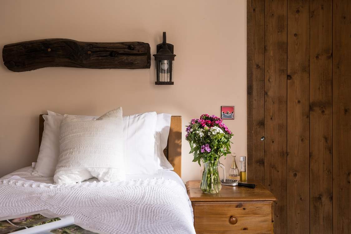 Pretty flowers always bring cheer to a bedroom.