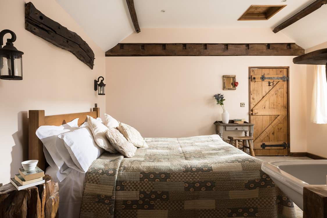 The sun streams into this delightful king-size bedroom.