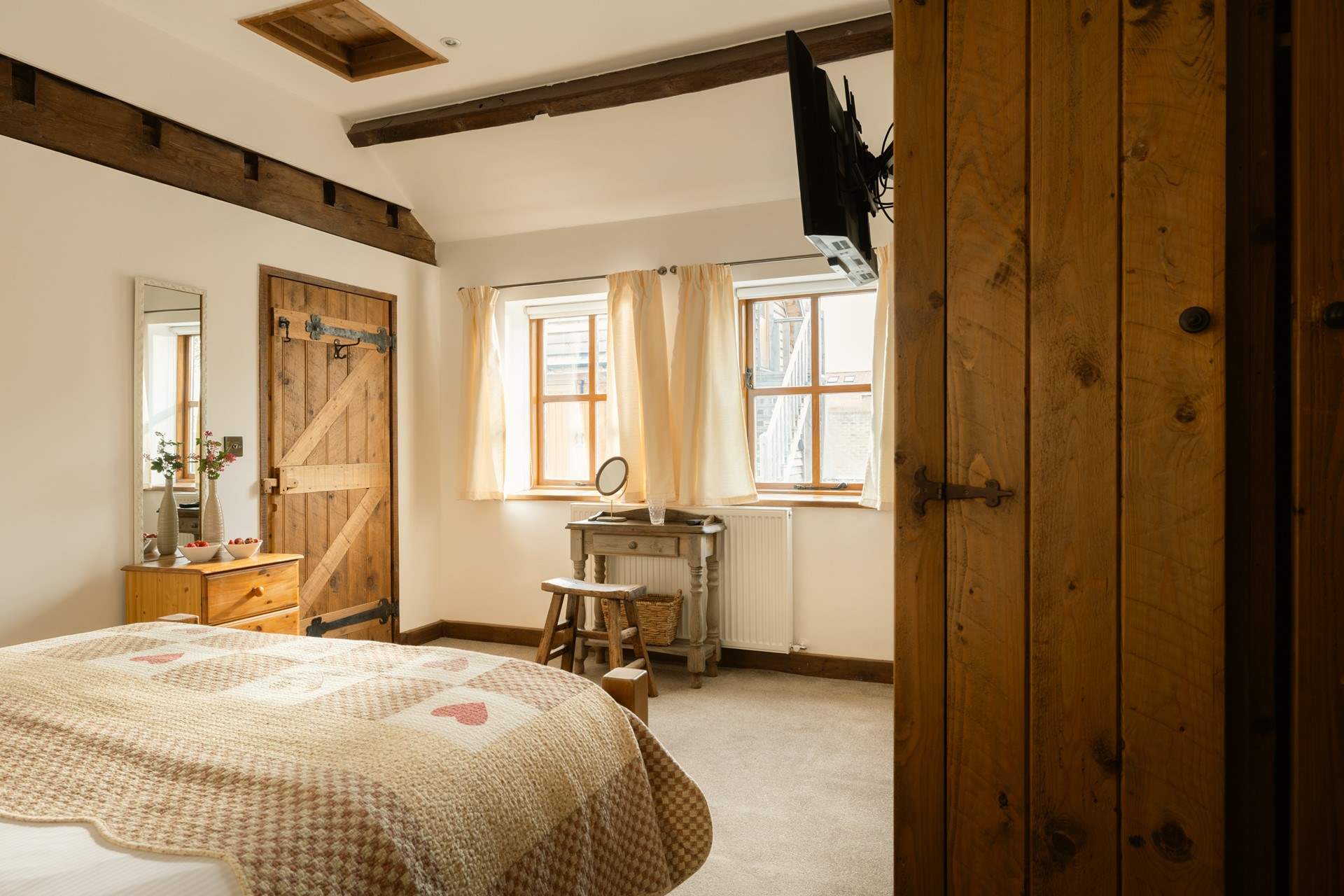 The sun streams into this delightful king-size bedroom.