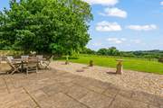 Step out of the living-room doors onto your large patio.