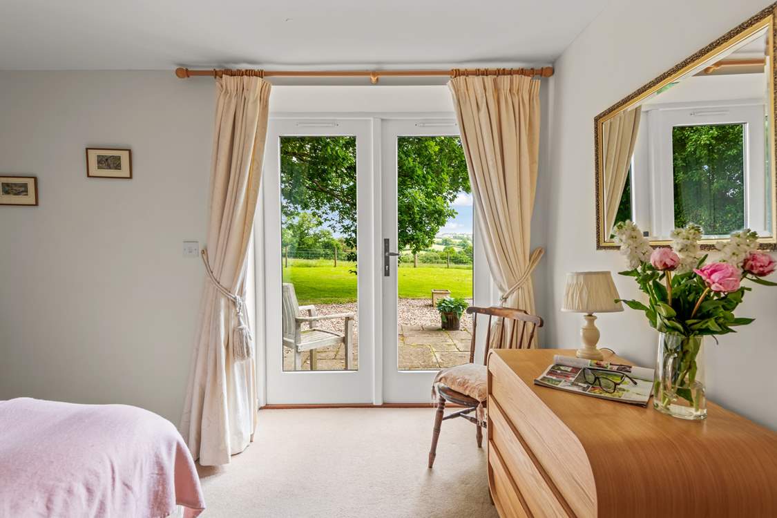 Bedroom 1 leads directly onto the patio-area.