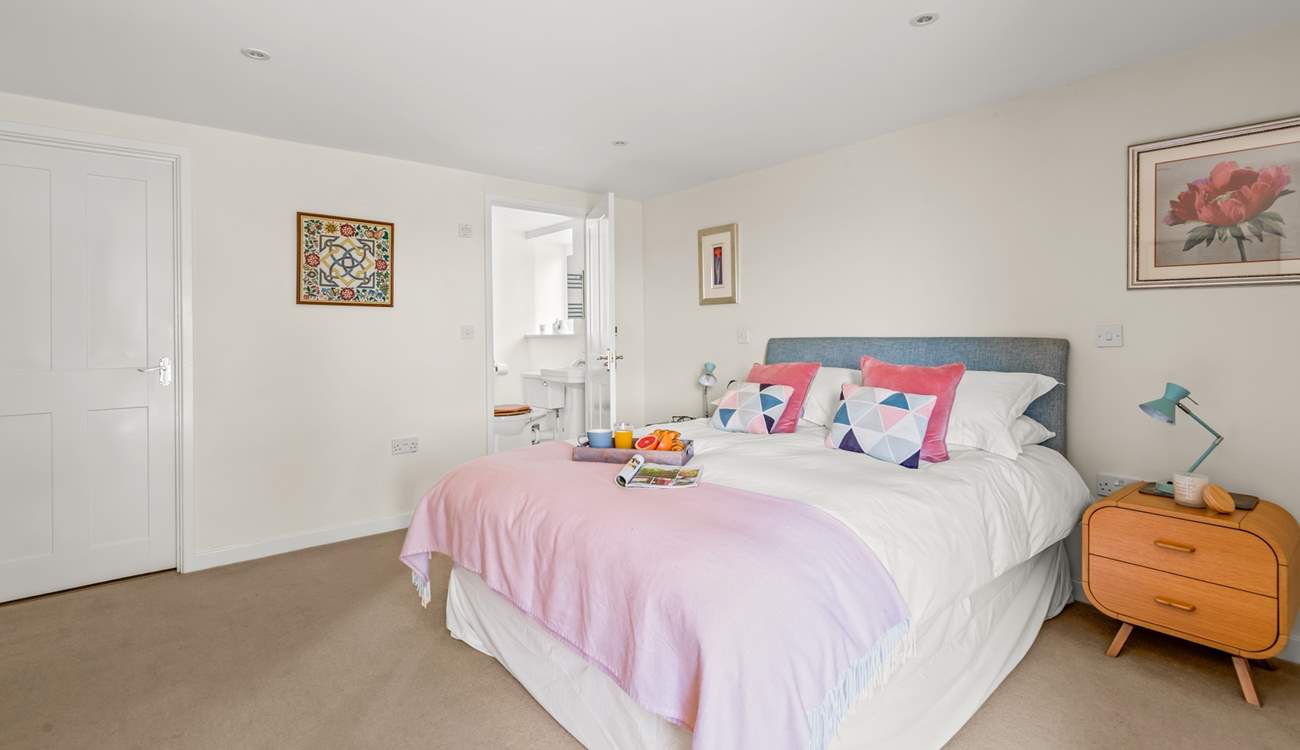 Bedroom 1 on the ground floor is spacious and inviting.