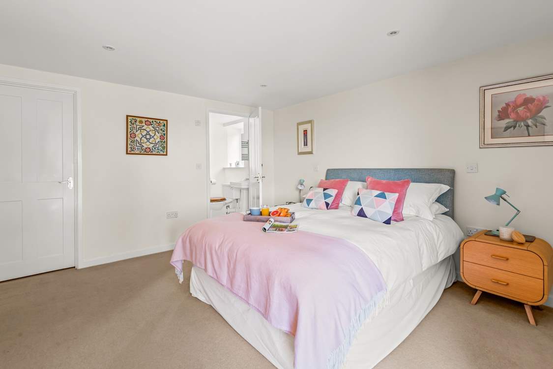 Bedroom 1 on the ground floor is spacious and inviting.