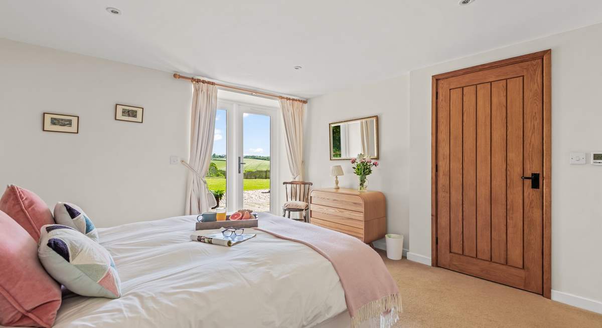 Bedroom 1 is home to this super inviting king-size bed.