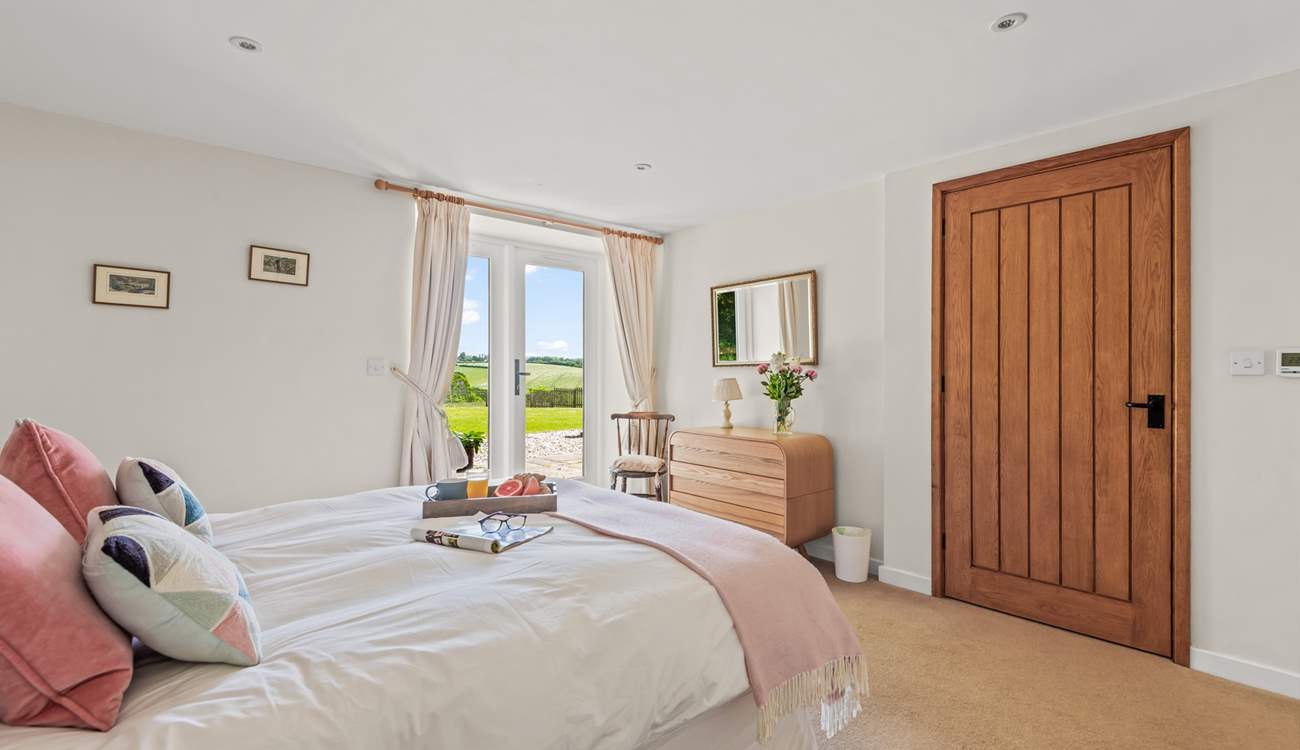 Bedroom 1 is home to this super inviting king-size bed.