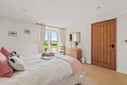 Bedroom 1 is home to this super inviting king-size bed.