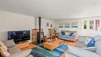The wood-burner makes this lovely space so warm and inviting, especially during the cooler months.