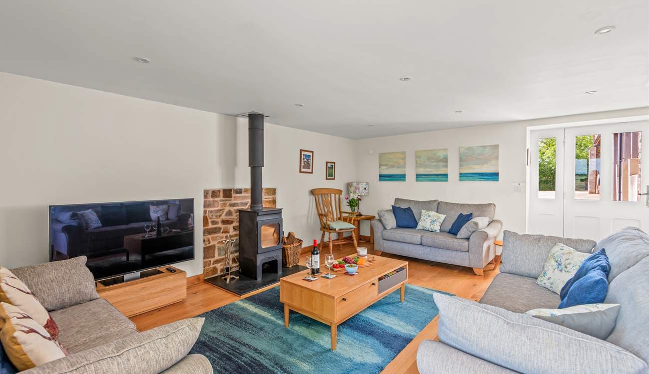 The wood-burner makes this lovely space so warm and inviting, especially during the cooler months.