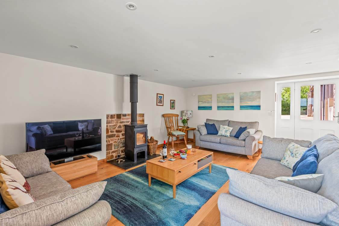The wood-burner makes this lovely space so warm and inviting, especially during the cooler months.