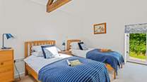 Bedroom 3 is home to these delightful single beds.