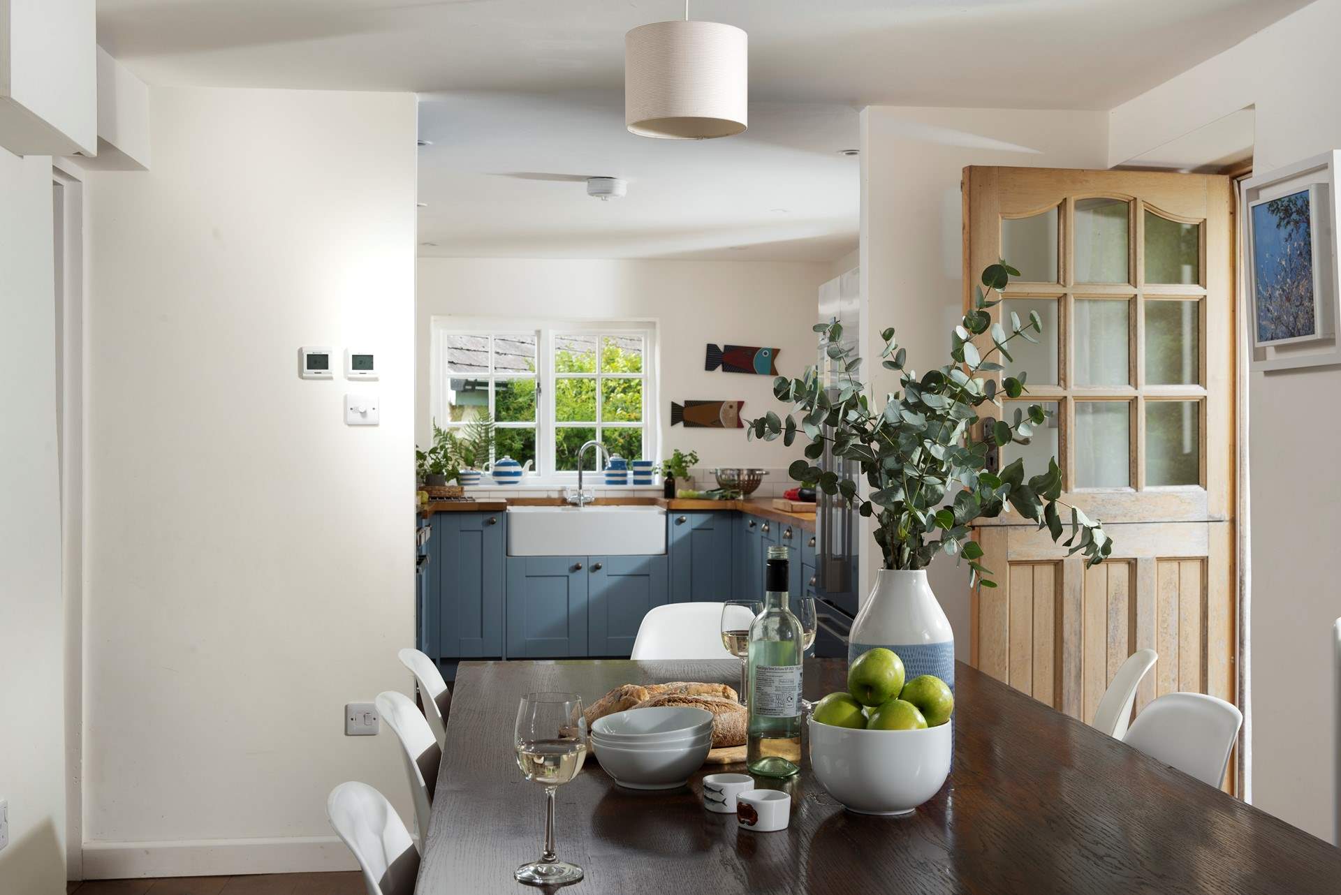 The large dining-table is the perfect place to gather with your loved ones. 