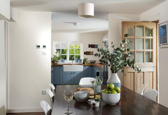The large dining-table is the perfect place to gather with your loved ones. 