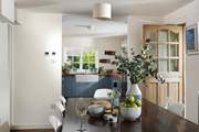 The large dining-table is the perfect place to gather with your loved ones.